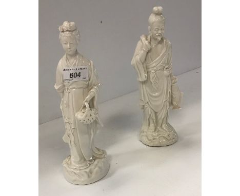 Two Chinese blanc de chine figures of a fisherman and woman with basket of leaves, a celadon glazed Chinese jar lamp, a black