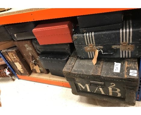 A collection of various trunks and suitcases to include a Victorian painted ebonised and slatted wooden trunk initialled "M.A