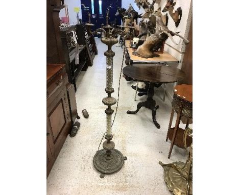 A cast brass and wrythen clear glass column standard lamp in the 19th Century Continental taste, 139 cm high CONDITION REPORT