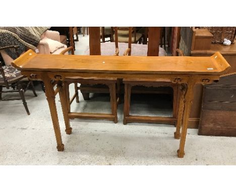 A 20th Century Chinese elm altar-style side table with scroll-work carved decoration on square tapered legs, 157 cm wide by 8