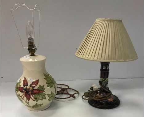A modern Moorcroft table lamp of baluster form with cream ground and floral decoration, 31cm high including bayonet fitting, 