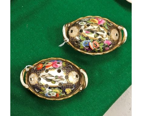 A pair of early 19th century Spode pot pourris of oval form, the pierced covers with twisted branch handles and floral spray 