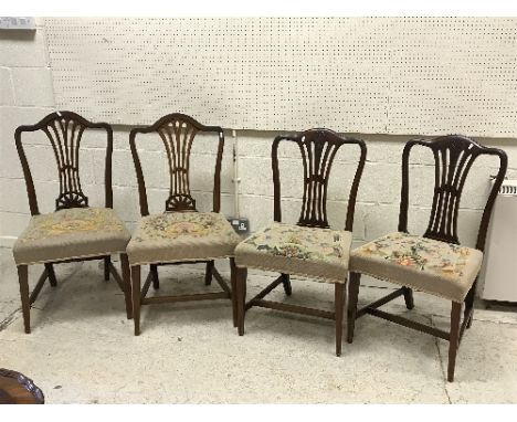 A collection of eight various 19th Century mahogany dining chairs with needlework upholstered seats, together with another ea