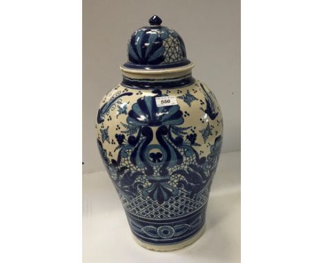 A 19th Century Delft lidded jar of baluster form, 50 cm high CONDITION REPORTS Has crazing throughout.  Areas of glaze are no