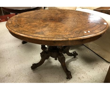 A Victorian burr walnut oval loo table on quadruped base and castors, 119 cm x 86 cm CONDITION REPORTS Whilst basically sound