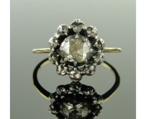 Antique old-cut diamond cluster ring,
setting height 12mm, unmarked gold and silver settings, size R.