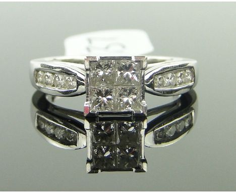 A modern 18ct white gold diamond panel ring,
with diamond set shoulders, approx. 0.6cts total, size L.