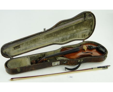 A German violin with paper label after Magini,  
and bow, in case.