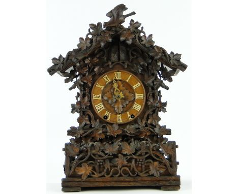 A rare 19th century carved Black Forest bracket clock,
having an 8-day movement, attributed to Johan Baptise Bayer, height 17