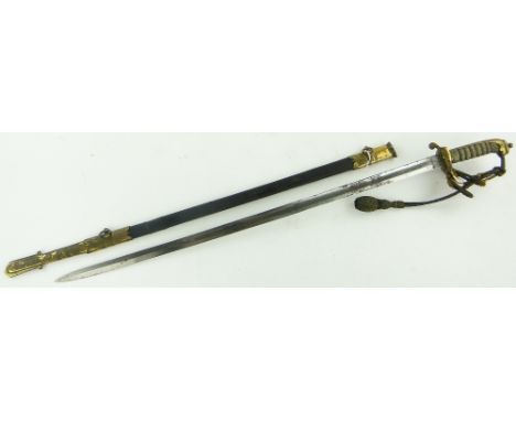 A Dartmouth naval sword 
in brass mounted scabbard.