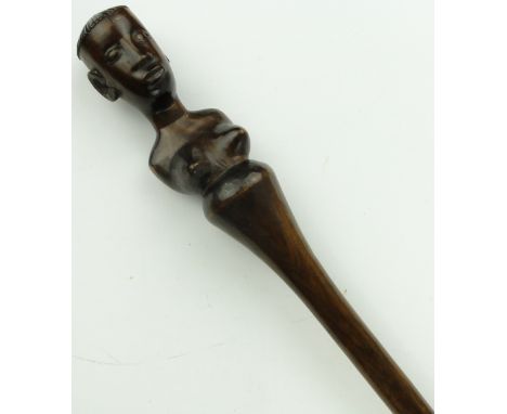 An African hardwood staff with female finial, 
length 54.5".