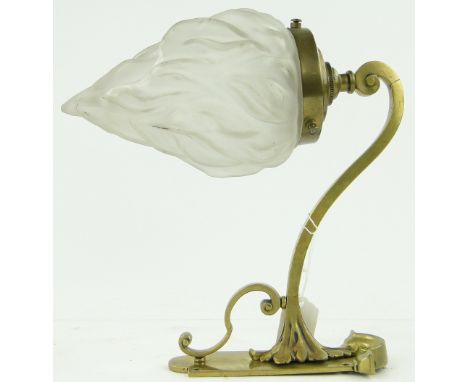 A brass wall light
with flame design shade, height 10".