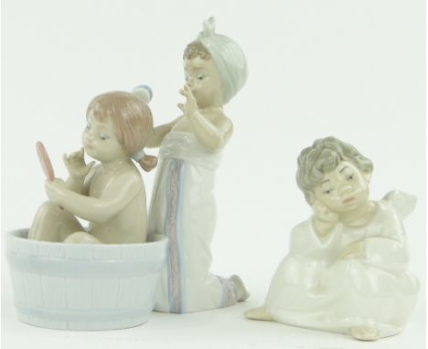 A Lladro Angel, 
height 4" and a Lladro bath tub scene, (2).