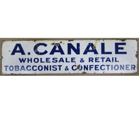 An enamel advertising sign "A.Canale Wholesale & Retail Tobacconist & Confectioner," 
60" x 15".