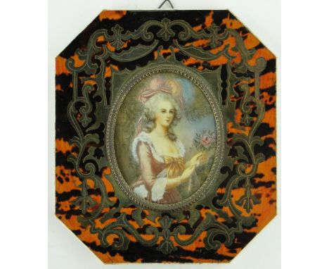 A portrait miniature of a lady
in a boulle work tortoise shell and ivory frame, height 6".