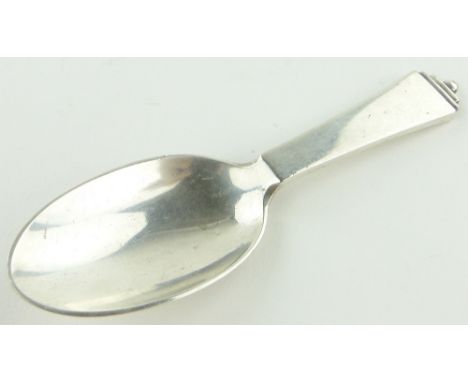 A Georg Jensen pyramid pattern silver caddy spoon,
with Swedish Import marks, length 10cm.