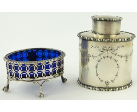 A Victorian plated and engraved tea caddy,
together with a pierced silver salt with blue glass liner, (2).