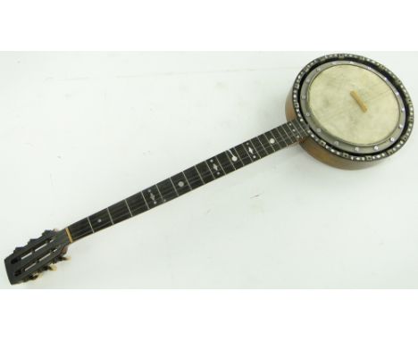 A banjo with inlaid stringing and mother of pearl decoration.