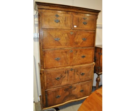 An antique American style walnut 2-section tall boy,
of shallow form, the upper part having 2 short and 3 long drawers with r