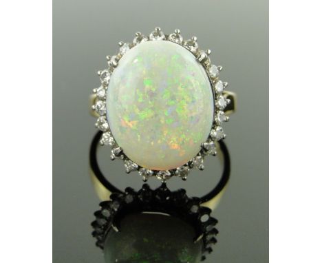 18ct gold large opal and diamond cluster ring,
diamond content approx. 0.5cts, setting height 18mm, size R.