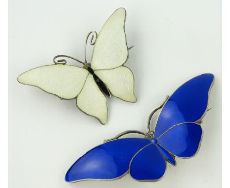 2 silver and enamel butterfly brooches,
largest width 70mm.