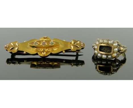 A Victorian unmarked gold and pearl memorial ring,
together with a 15ct gold gemstone set brooch, (2).