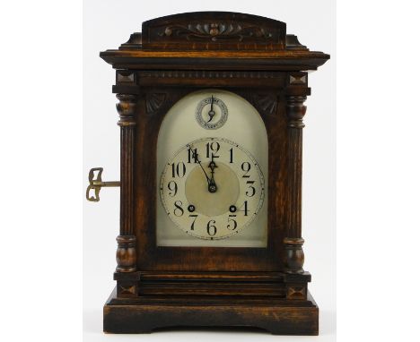 Edwardian carved oak cased mantel clock with 2-train striking movement,
height 17.5".