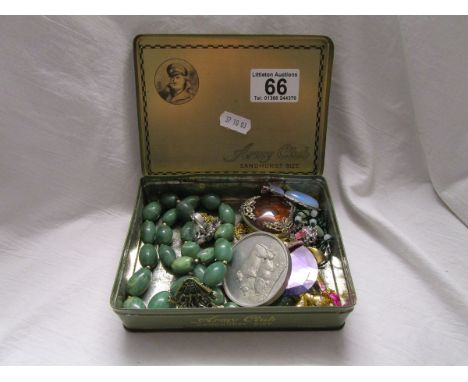 Army club tin containing costume jewellery