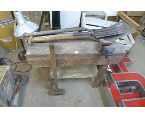 A work bench and garden tools