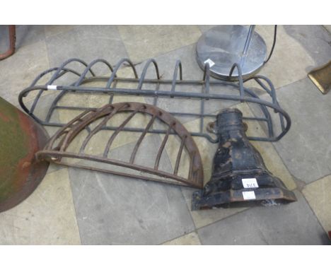 A cast iron drain hopper and two hay racks