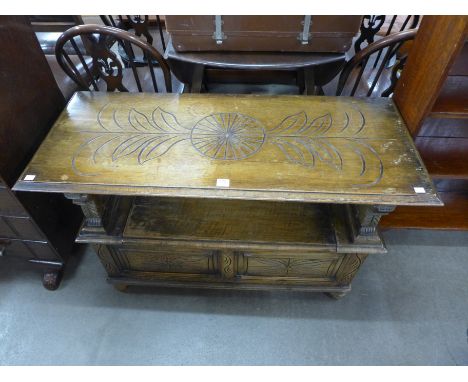 A carved oak monks bench