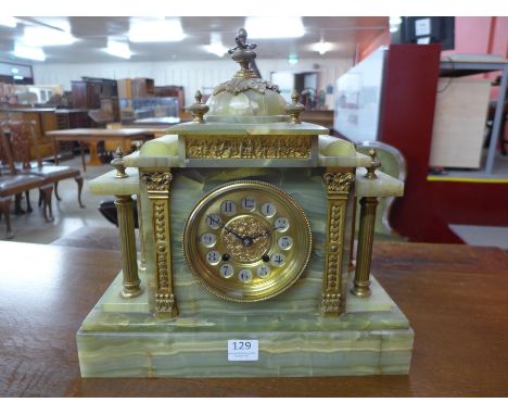 A 19th Century French architectural cased onyx and gilt metal mantel clock