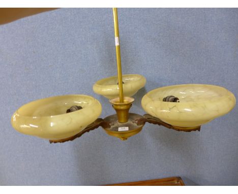 A gilt metal and glass ceiling light