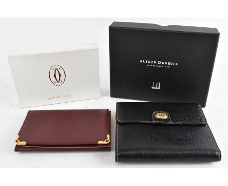 ALFRED DUNHILL; a boxed leather purse with original pouch and a boxed Must de Cartier card wallet (2).