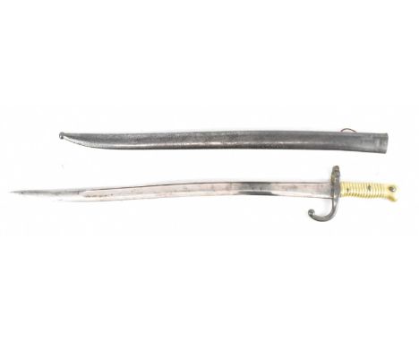 A late 19th century French chassepot bayonet with ribbed brass grip and scabbard, various impressed numbers, length 71cm.