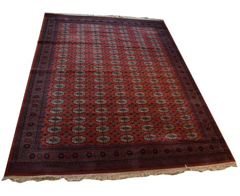 A large red ground Super Kashan Persian design carpet, with geometric pattern, 358 x 274cm.Condition Report: This rug is in g