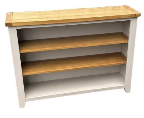A modern white painted bookcase with light oak top and two light oak removable shelves, width 132cm.