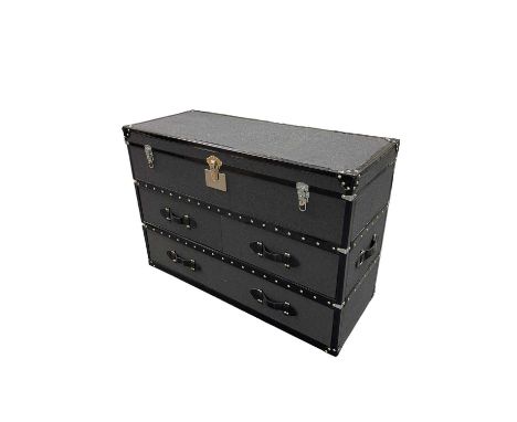 IN THE STYLE OF TIMOTHY OULTON; a modern felt and leather bound travelling trunk/chest of drawers, with hinged lid above two 
