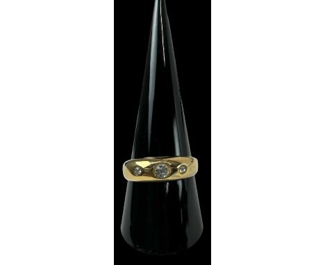 A yellow metal ring set with three white stones, size R/S, approx 2.7g.