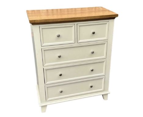 A modern white painted light oak topped chest of two short over three long drawers, on bracket feet, width 90cm.
