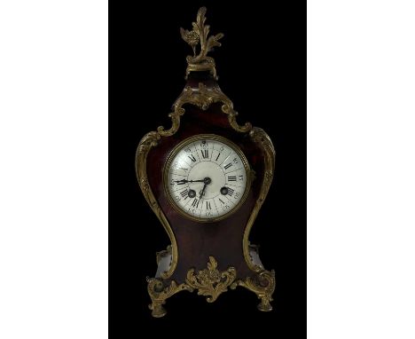 A 19th century French red lacquer and gilt mounted eight day mantel clock, height 36cm.