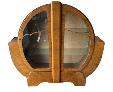 A 1930s Art Deco walnut display cabinet with pair of glazed doors, width 134cm, height 126cm.
