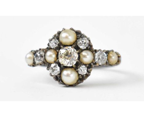 A white metal diamond and seed pearl set ring, the central stone approx 0.35ct, total diamond weight approx 1ct, size N, appr