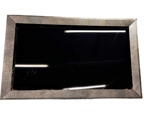 A Samsung 65" flatscreen television with frame.Condition Report: This item has not been tested.