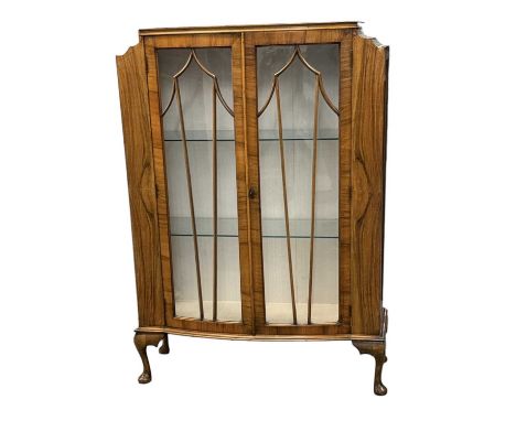 A 1930s Art Deco walnut display cabinet with pair of glazed doors, width 90 cm.