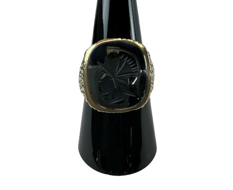 A 9ct yellow gold intaglio ring set with central hardstone carved as a warrior, size P, approx 9.1g.