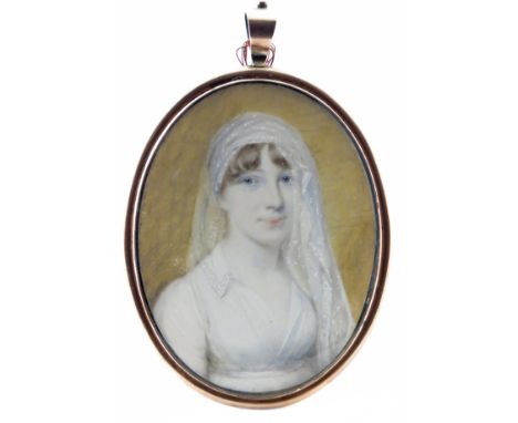 λ English School 19th Century  Portrait miniature of lady, head and shoulders, with a white headdress  Oval, in a gilt metal 