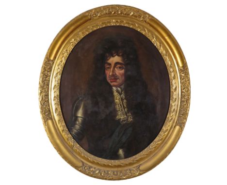 English School 17th Century Portrait of Charles II; Portrait of a Gentleman Two, both oval, in carved wood frames Each 77 x 6