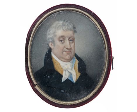 λ English School early 19th Century  Portrait miniature of a gentleman, head and shoulders, in blue  Oval, in a red leather h