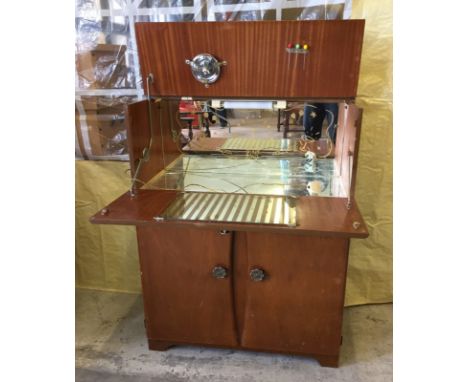 Complete with cocktail sticks and lemon squeezer. One mirrored panel cracked. Approx. 77cm x 100cm (when closed)